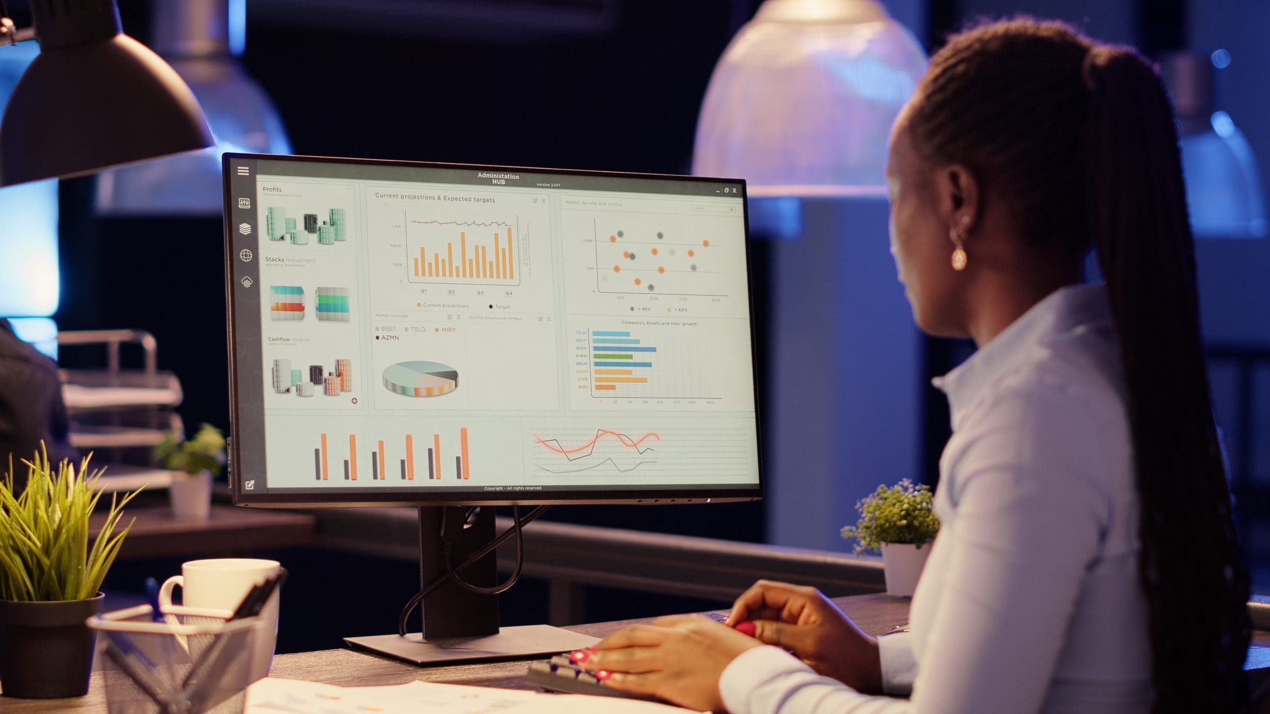 Executive manager planning web presentation with charts on computer monitor